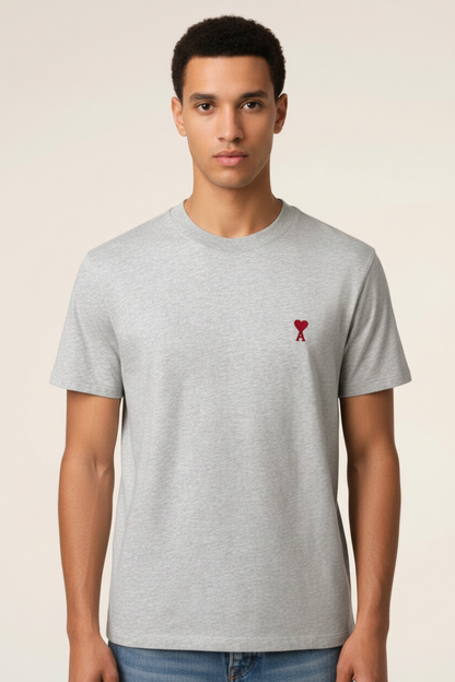 Man wearing light grey t-shirt with red heart-A logo