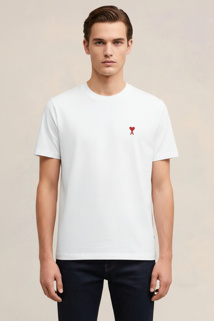 Man wearing white t-shirt with red heart logo