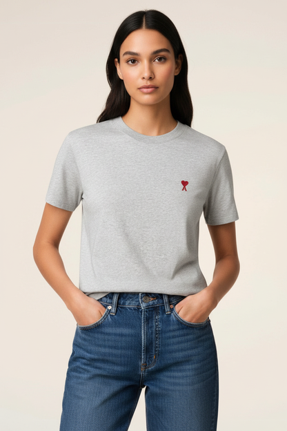 Woman wearing full light grey t-shirt with red heart-A logo