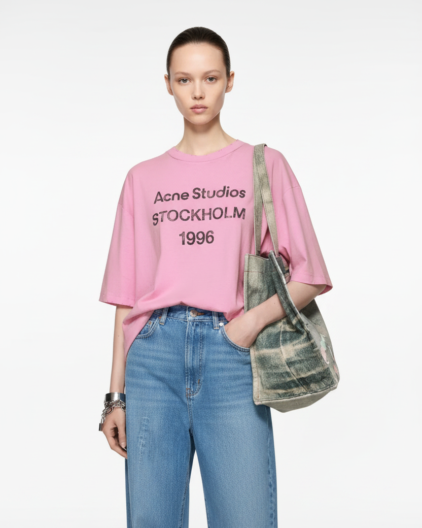 Woman wearing pink Acne Studios tee