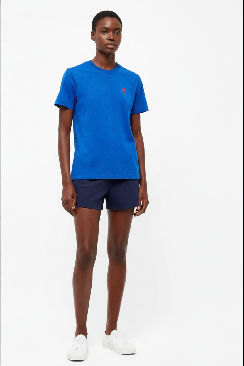 Woman wearing royal blue t-shirt with red heart-A logo